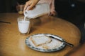 Woman pouring milk into a glass Royalty Free Stock Photo