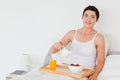 Woman pouring milk into her cereal Royalty Free Stock Photo