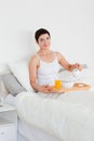 Woman pouring milk into her cereal Royalty Free Stock Photo