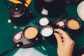 Woman pouring milk in mug of tea from kettle. Royalty Free Stock Photo