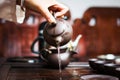 Woman pouring out first round of tea, Chinese Tea ceremony Royalty Free Stock Photo