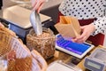 Woman pouring pinto bean to paper paper bag