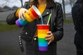 Woman pouring soda into a glass at a party