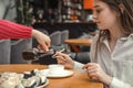 Woman pouring soy sauce on sushi roll. Sticks of sushi soy sauce Royalty Free Stock Photo