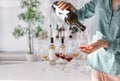 Woman pouring tasty wine into glass
