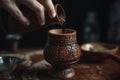 Woman pouring tea in clay pot on wooden table, Pouring Turkish coffee close up from a decorated coffee cup, AI Generated Royalty Free Stock Photo