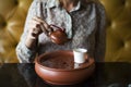 Woman pouring tea into a cup Royalty Free Stock Photo