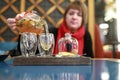 Woman pouring tea from glass teapot Royalty Free Stock Photo