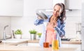 Woman pouring used cooking oil for recycling and reuse into the plastic bottle to be made in the factory into the fuel additive Royalty Free Stock Photo