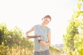 Woman pouring wine from bottle in glass on sunny day Royalty Free Stock Photo