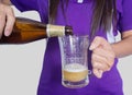 Woman pours beer