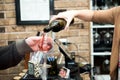 Woman pours glass of red wine