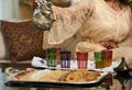 A woman Pours Moroccan Tea