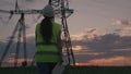 woman power engineer helmet with tablet her hands works. governing body of electricity industry. electrical engineer job