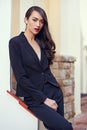 Woman, power suit and fashion with hair outdoor, confidence and pride with makeup, elegance and professional outfit