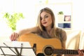 Woman Practice Acoustic Guitar Playing at Home Royalty Free Stock Photo