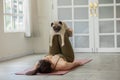 woman practice yoga with dog pug breed enjoy and relax with yoga at home Royalty Free Stock Photo