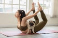 woman practice yoga with dog pug breed enjoy and relax with yoga at home Royalty Free Stock Photo