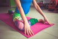 Woman practice yoga indoor extension of lower limbs closeup