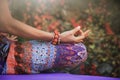 woman practice yoga meditation hands in mudra gesture closeup outdoor