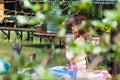 Woman practice yoga outdoor spring summer  day by the lake sit in lotus position with hands in anjali mudra Royalty Free Stock Photo