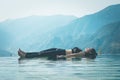 Woman practice yoga on the pool above the Mountain peak Royalty Free Stock Photo