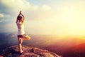 Woman practice yoga at sunrise seaside