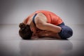 Woman practices yoga asana Baddha konasana