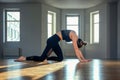 A woman practices yoga in a fitness room at dawn. Concentration, beautiful sunshine, stretching, healthy lifestyle.