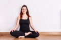 Woman practices yoga and meditates in the lotus position Royalty Free Stock Photo