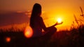 Woman practices yoga and meditates on the nature Royalty Free Stock Photo