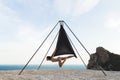 Woman practicing fly dance gravity yoga poses in a hammock outdoors Royalty Free Stock Photo