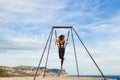 Woman practicing fly dance gravity yoga poses in a hammock outdoors Royalty Free Stock Photo