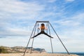 Woman practicing fly dance gravity yoga poses in a hammock outdoors Royalty Free Stock Photo