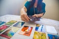 Woman practicing fortune-telling with tarot cards