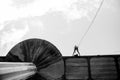 Woman practicing rappel on a pedestrian walkway