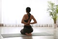 Woman practicing seiza asana in yoga studio. Vajrasana pose