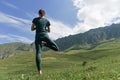 Woman practicing yoga in a beautiful outdoor setting Royalty Free Stock Photo