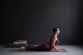 Woman practicing yoga, doing Cobra exercise, Bhujangasana pose Royalty Free Stock Photo