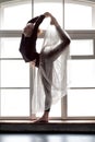 Woman practicing yoga, doing Natarajasana exercise, Lord of the Dance pose