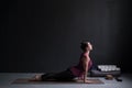 Woman practicing yoga, doing urdhva mukha svanasana, upward facing dog pose Royalty Free Stock Photo