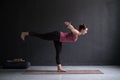 Woman practicing yoga, doing Warrior III exercise, Virabhadrasana 3 pose Royalty Free Stock Photo