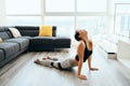 Woman Practicing Yoga At Home Doing Sun Salutation Routine Royalty Free Stock Photo