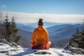 Woman practicing Yoga on mountain in winter Royalty Free Stock Photo