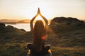 Woman practicing yoga outdoors. Spiritual harmony and well-being concept