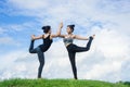 Woman practicing yoga relax in nature and blue sky background Royalty Free Stock Photo