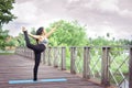 Woman practicing yoga relax in nature and blue sky background