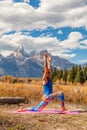 Woman Practicing Yoga in the Tetons in Fall