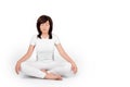 Woman practicing yoga on white background. Girl wearing white meditating with closed eyes, sitting in lotus position or Royalty Free Stock Photo