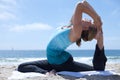 Woman Practicing Yogo at the Beach Royalty Free Stock Photo